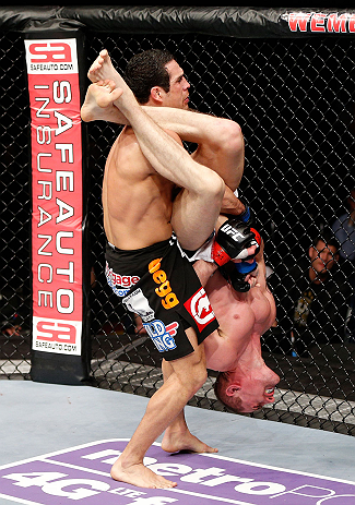 LONDON, ENGLAND - FEBRUARY 16: (R-L) Paul Sass attempts an arm bar submission against Danny Castillo in their lightweight fight during the UFC on Fuel TV event on February 16, 2013 at Wembley Arena in London, England. (Photo by Josh Hedges/Zuffa LLC/Zuf