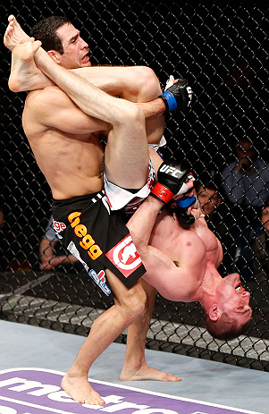 LONDON, ENGLAND - FEBRUARY 16: (R-L) Paul Sass attempts an arm bar submission against Danny Castillo in their lightweight fight during the UFC on Fuel TV event on February 16, 2013 at Wembley Arena in London, England. (Photo by Josh Hedges/Zuffa LLC/Zuf