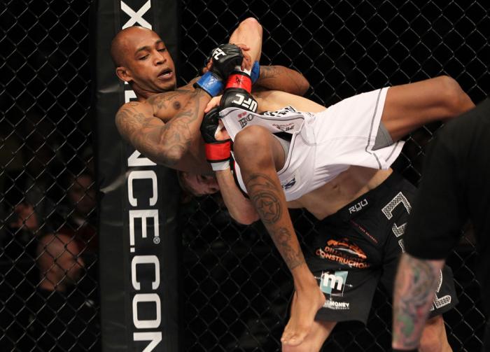OMAHA, NE - FEBRUARY 15: (R-L) TJ Dillashaw prepares to slam Walel Watson during the UFC on FUEL TV event at Omaha Civic Auditorium on February 15, 2012 in Omaha, Nebraska. (Photo by Josh Hedges/Zuffa LLC/Zuffa LLC via Getty Images) *** Local Caption **
