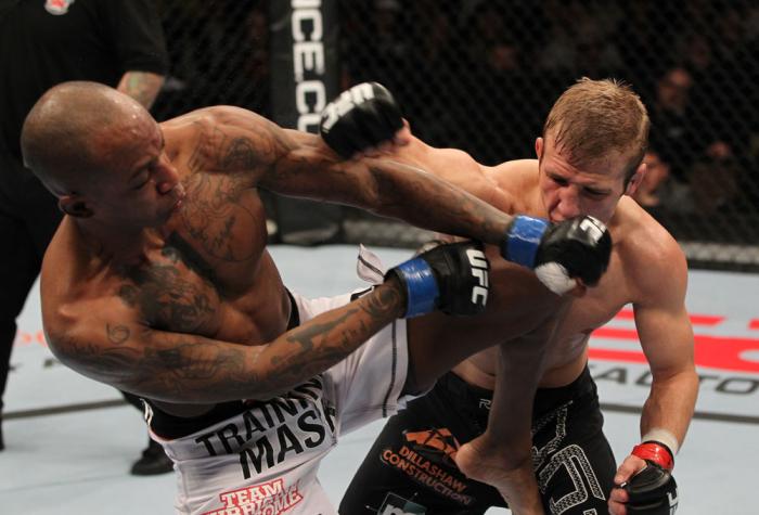 OMAHA, NE - FEBRUARY 15: (R-L) TJ Dillashaw punches Walel Watson during the UFC on FUEL TV event at Omaha Civic Auditorium on February 15, 2012 in Omaha, Nebraska. (Photo by Josh Hedges/Zuffa LLC/Zuffa LLC via Getty Images) *** Local Caption *** TJ Dill