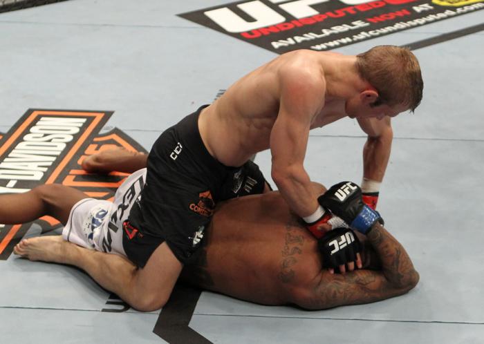 OMAHA, NE - FEBRUARY 15: TJ Dillashaw punches down at Walel Watson on the ground during the UFC on FUEL TV event at Omaha Civic Auditorium on February 15, 2012 in Omaha, Nebraska. (Photo by Josh Hedges/Zuffa LLC/Zuffa LLC via Getty Images) *** Local Cap