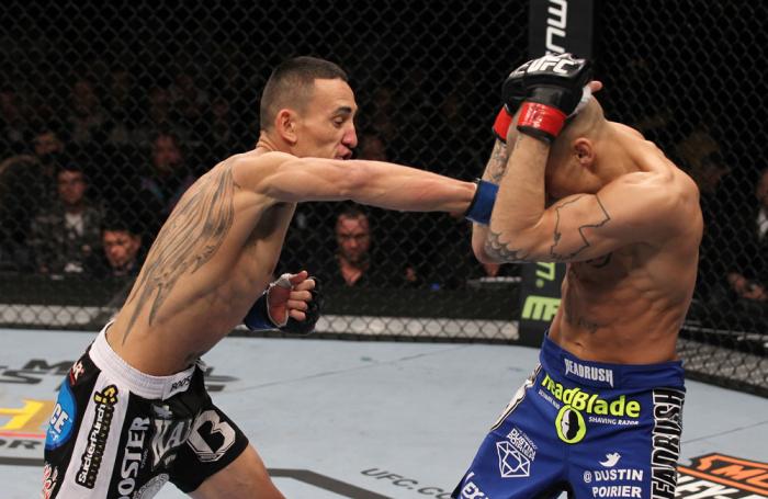 LAS VEGAS, NV - FEBRUARY 04: Max Holloway (left) punches Dustin Poirier during the UFC 143 event at Mandalay Bay Events Center on February 4, 2012 in Las Vegas, Nevada. (Photo by Nick Laham/Zuffa LLC/Zuffa LLC via Getty Images) *** Local Caption *** Max