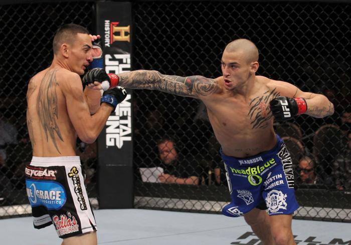 LAS VEGAS, NV - FEBRUARY 04: Dustin Poirier (right) punches Max Holloway during the UFC 143 event at Mandalay Bay Events Center on February 4, 2012 in Las Vegas, Nevada. (Photo by Nick Laham/Zuffa LLC/Zuffa LLC via Getty Images) *** Local Caption *** Du