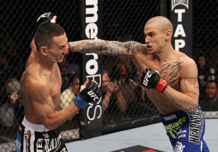 LAS VEGAS, NV - FEBRUARY 04: Dustin Poirier (right) punches Max Holloway during the UFC 143 event at Mandalay Bay Events Center on February 4, 2012 in Las Vegas, Nevada. (Photo by Nick Laham/Zuffa LLC/Zuffa LLC via Getty Images) *** Local Caption *** Du