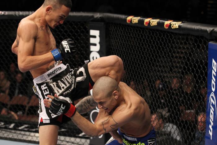 LAS VEGAS, NV - FEBRUARY 04: Max Holloway (black shorts) delivers a knee to Dustin Poirier during the UFC 143 event at Mandalay Bay Events Center on February 4, 2012 in Las Vegas, Nevada. (Photo by Nick Laham/Zuffa LLC/Zuffa LLC via Getty Images) *** Lo