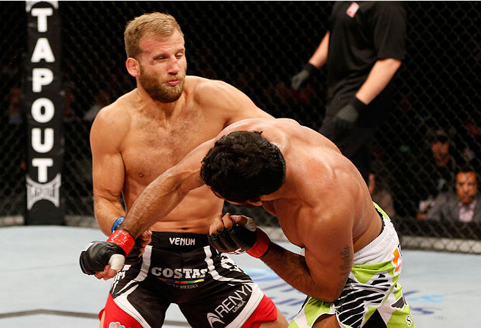 BELO HORIZONTE, BRAZIL - SEPTEMBER 04: (R-L) Rafael Natal drops Tor Troeng with a punch in their middleweight fight during the UFC on FOX Sports 1 event at Mineirinho Arena on September 4, 2013 in Belo Horizonte, Brazil. (Photo by Josh Hedges/Zuffa LLC/Z
