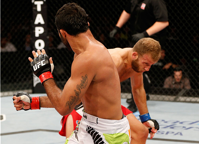 BELO HORIZONTE, BRAZIL - SEPTEMBER 04: (R-L) Tor Troeng is knocked down by a punch from Rafael Natal in their middleweight fight during the UFC on FOX Sports 1 event at Mineirinho Arena on September 4, 2013 in Belo Horizonte, Brazil. (Photo by Josh Hedge