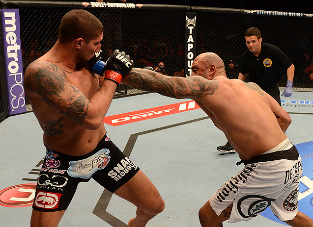 ANAHEIM, CA - FEBRUARY 23: (R-L) Lavar Johnson punches Brendan Schaub in their heavyweight bout during UFC 157 at Honda Center on February 23, 2013 in Anaheim, California. (Photo by Donald Miralle/Zuffa LLC/Zuffa LLC via Getty Images) *** Local Caption