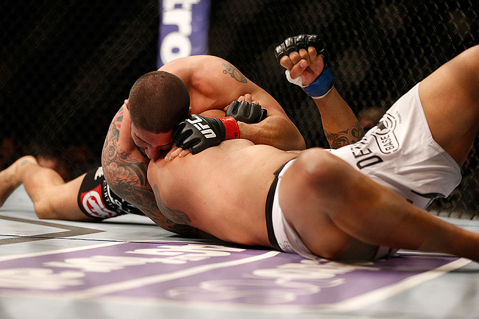 ANAHEIM, CA - FEBRUARY 23: Brendan Schaub (left) attempts to submit Lavar Johnson in their heavyweight bout during UFC 157 at Honda Center on February 23, 2013 in Anaheim, California. (Photo by Josh Hedges/Zuffa LLC/Zuffa LLC via Getty Images) *** Local