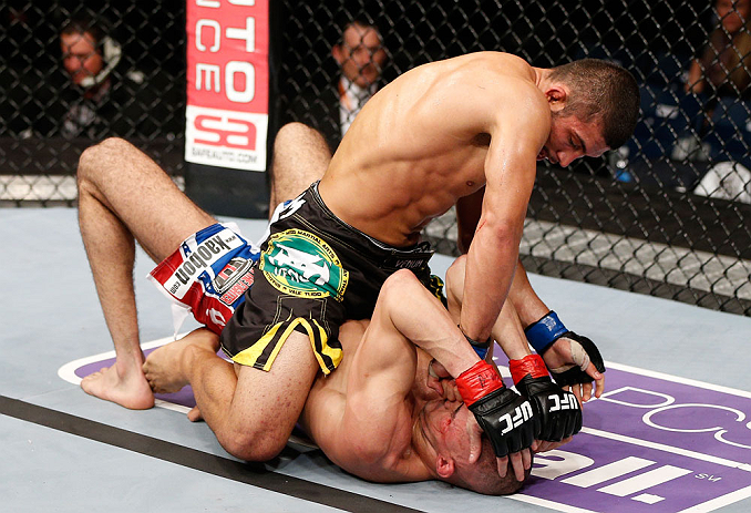 LONDON, ENGLAND - FEBRUARY 16: (L-R) Renee Forte punches Terry Etim in their lightweight fight during the UFC on Fuel TV event on February 16, 2013 at Wembley Arena in London, England. (Photo by Josh Hedges/Zuffa LLC/Zuffa LLC via Getty Images)