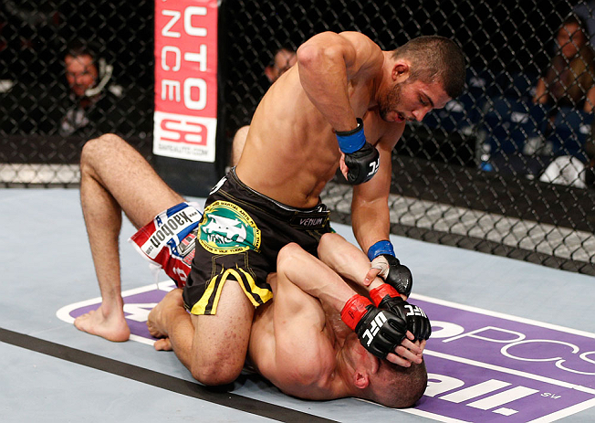 LONDON, ENGLAND - FEBRUARY 16: (L-R) Renee Forte punches Terry Etim in their lightweight fight during the UFC on Fuel TV event on February 16, 2013 at Wembley Arena in London, England. (Photo by Josh Hedges/Zuffa LLC/Zuffa LLC via Getty Images)