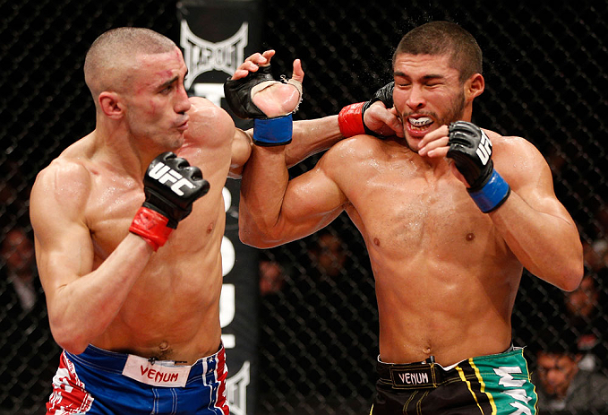 LONDON, ENGLAND - FEBRUARY 16: (L-R) Terry Etim punches Renee Forte in their lightweight fight during the UFC on Fuel TV event on February 16, 2013 at Wembley Arena in London, England. (Photo by Josh Hedges/Zuffa LLC/Zuffa LLC via Getty Images)
