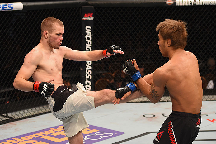 LAS VEGAS, NV - JANUARY 02: (L-R) Michael McDonald kicks Masanori Kanehara of Japan in their bantamweight bout during the UFC 195 event inside MGM Grand Garden Arena on January 2, 2016 in Las Vegas, Nevada. (Photo by Josh Hedges/Zuffa LLC/Zuffa LLC via G