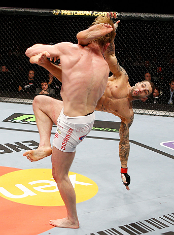 LONDON, ENGLAND - FEBRUARY 16: (R-L) Che Mills kicks Matthew Riddle after a takedown in their welterweight fight during the UFC on Fuel TV event on February 16, 2013 at Wembley Arena in London, England. (Photo by Josh Hedges/Zuffa LLC/Zuffa LLC via Gett