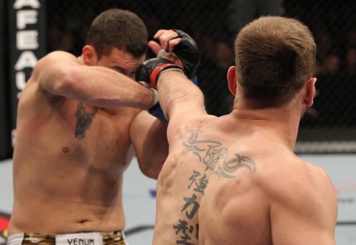 OMAHA, NE - FEBRUARY 15: (R-L) Stipe Miocic punches Phil De Fries during the UFC on FUEL TV event at Omaha Civic Auditorium on February 15, 2012 in Omaha, Nebraska. (Photo by Josh Hedges/Zuffa LLC/Zuffa LLC via Getty Images) *** Local Caption *** Stipe