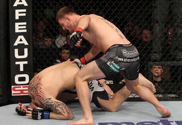 OMAHA, NE - FEBRUARY 15: (R-L) Stipe Miocic punches Phil De Fries during the UFC on FUEL TV event at Omaha Civic Auditorium on February 15, 2012 in Omaha, Nebraska. (Photo by Josh Hedges/Zuffa LLC/Zuffa LLC via Getty Images) *** Local Caption *** Stipe