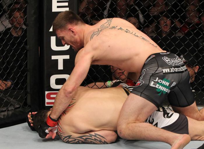 OMAHA, NE - FEBRUARY 15: (R-L) Stipe Miocic punches Phil De Fries during the UFC on FUEL TV event at Omaha Civic Auditorium on February 15, 2012 in Omaha, Nebraska. (Photo by Josh Hedges/Zuffa LLC/Zuffa LLC via Getty Images) *** Local Caption *** Stipe