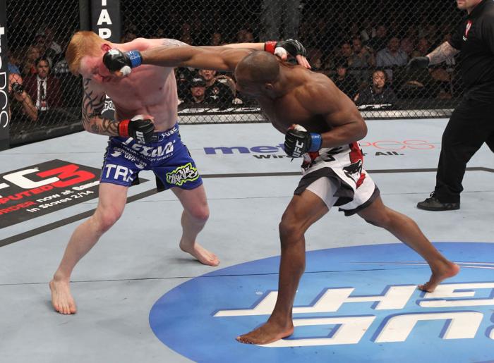 LAS VEGAS, NV - FEBRUARY 04: (R-L) Clifford Starks punches Ed Herman during the UFC 143 event at Mandalay Bay Events Center on February 4, 2012 in Las Vegas, Nevada. (Photo by Nick Laham/Zuffa LLC/Zuffa LLC via Getty Images) *** Local Caption *** Cliffo