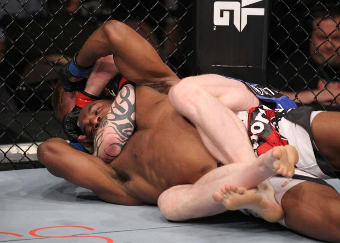 LAS VEGAS, NV - FEBRUARY 04: Ed Herman attempts to submit Clifford Starks (red/white/black shorts) during the UFC 143 event at Mandalay Bay Events Center on February 4, 2012 in Las Vegas, Nevada. (Photo by Nick Laham/Zuffa LLC/Zuffa LLC via Getty Images