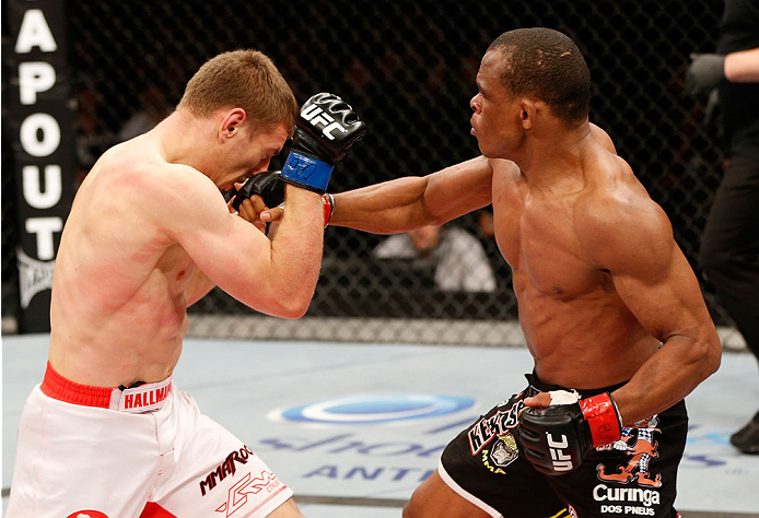 BELO HORIZONTE, BRAZIL - SEPTEMBER 04: (R-L) Francisco Trinaldo punches Piotr Hallmann in their lightweight fight during the UFC on FOX Sports 1 event at Mineirinho Arena on September 4, 2013 in Belo Horizonte, Brazil. (Photo by Josh Hedges/Zuffa LLC/Zuf