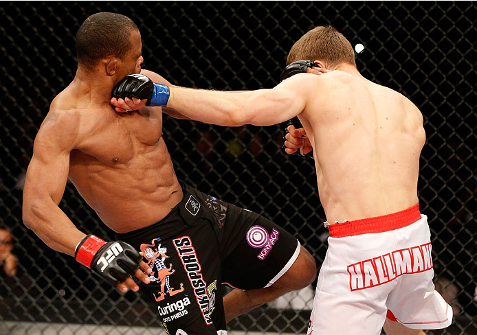 BELO HORIZONTE, BRAZIL - SEPTEMBER 04: (R-L) Piotr Hallmann punches Francisco Trinaldo in their lightweight fight during the UFC on FOX Sports 1 event at Mineirinho Arena on September 4, 2013 in Belo Horizonte, Brazil. (Photo by Josh Hedges/Zuffa LLC/Zuf