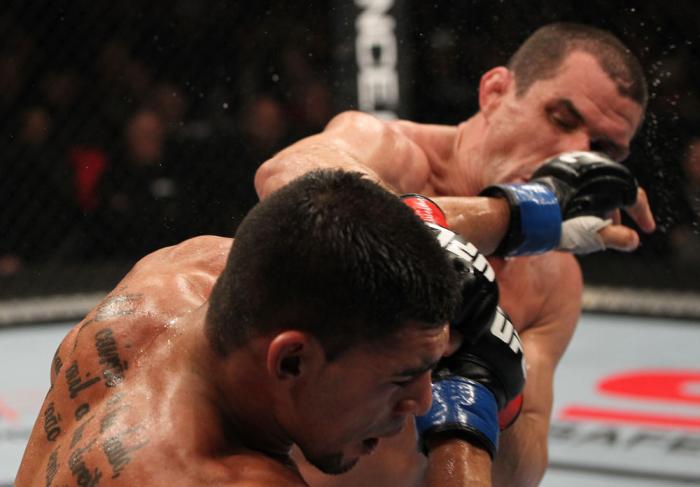 OMAHA, NE - FEBRUARY 15: (R-L) Aaron Simpson punches Ronny Markes during the UFC on FUEL TV event at Omaha Civic Auditorium on February 15, 2012 in Omaha, Nebraska. (Photo by Josh Hedges/Zuffa LLC/Zuffa LLC via Getty Images) *** Local Caption *** Aaron