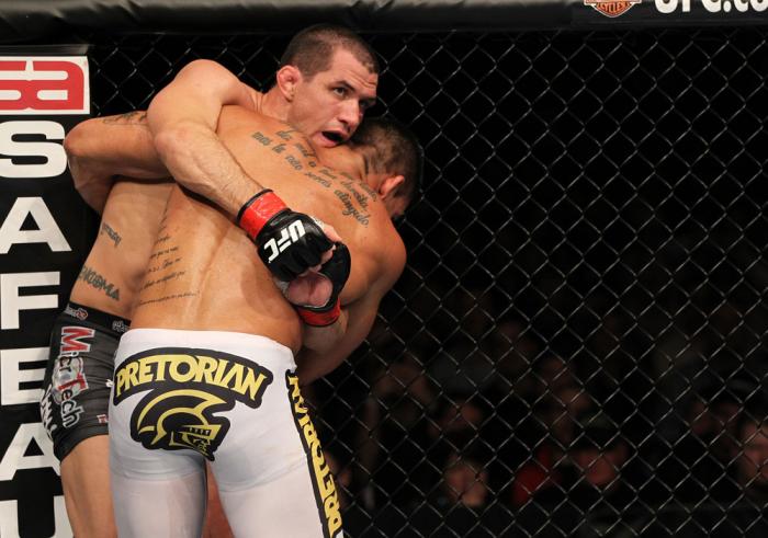 OMAHA, NE - FEBRUARY 15: (L-R) Aaron Simpson and Ronny Markes grapple for position during the UFC on FUEL TV event at Omaha Civic Auditorium on February 15, 2012 in Omaha, Nebraska. (Photo by Josh Hedges/Zuffa LLC/Zuffa LLC via Getty Images) *** Local C