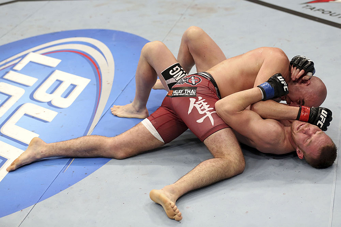 CALGARY, CANADA - JULY 21: (L-R) Brian Ebersole uses his body weight to get advantage of James Head during their welterweight bout at UFC 149 inside the Scotiabank Saddledome on July 21, 2012 in Calgary, Alberta, Canada. (Photo by Nick Laham/Zuffa LLC/Zu