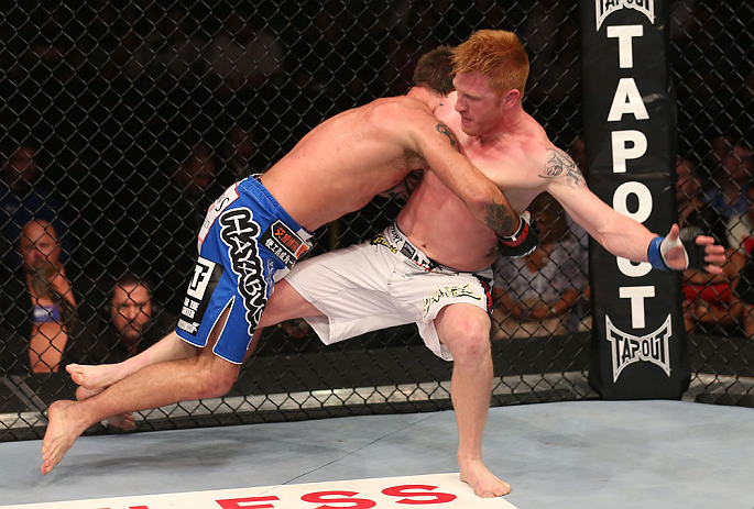 DENVER, CO - AUGUST 11: (L-R) Jake Shields takes down Ed Herman during their middleweight bout at UFC 150 inside Pepsi Center on August 11, 2012 in Denver, Colorado. (Photo by Nick Laham/Zuffa LLC/Zuffa LLC via Getty Images)