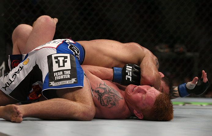DENVER, CO - AUGUST 11: Jake Shields (top) lands an elbow to the head of Ed Herman during their middleweight bout at UFC 150 inside Pepsi Center on August 11, 2012 in Denver, Colorado. (Photo by Josh Hedges/Zuffa LLC/Zuffa LLC via Getty Images)