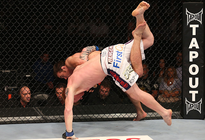 DENVER, CO - AUGUST 11: (R-L) Jake Shields takes down Ed Herman during their middleweight bout at UFC 150 inside Pepsi Center on August 11, 2012 in Denver, Colorado. (Photo by Nick Laham/Zuffa LLC/Zuffa LLC via Getty Images)