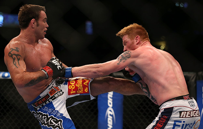 DENVER, CO - AUGUST 11: (L-R) Jake Shields kicks Ed Herman during their middleweight bout at UFC 150 inside Pepsi Center on August 11, 2012 in Denver, Colorado. (Photo by Josh Hedges/Zuffa LLC/Zuffa LLC via Getty Images)
