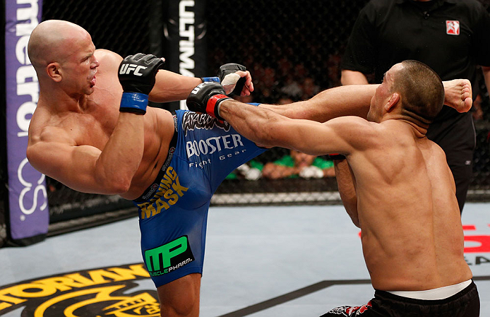LONDON, ENGLAND - FEBRUARY 16: (L-R) Ryan Jimmo kicks James Te Huna in their light heavyweight fight during the UFC on Fuel TV event on February 16, 2013 at Wembley Arena in London, England. (Photo by Josh Hedges/Zuffa LLC/Zuffa LLC via Getty Images)