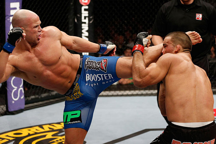 LONDON, ENGLAND - FEBRUARY 16: (L-R) Ryan Jimmo kicks James Te Huna in their light heavyweight fight during the UFC on Fuel TV event on February 16, 2013 at Wembley Arena in London, England. (Photo by Josh Hedges/Zuffa LLC/Zuffa LLC via Getty Images)