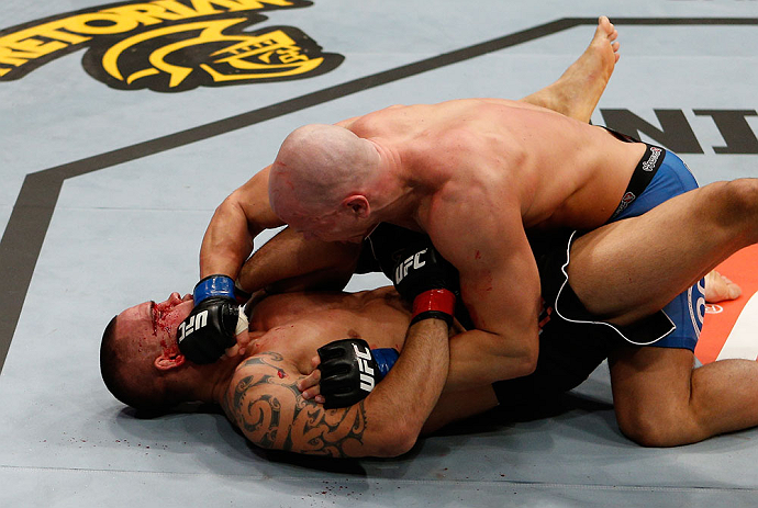 LONDON, ENGLAND - FEBRUARY 16: (R-L) Ryan Jimmo punches James Te Huna in their light heavyweight fight during the UFC on Fuel TV event on February 16, 2013 at Wembley Arena in London, England. (Photo by Josh Hedges/Zuffa LLC/Zuffa LLC via Getty Images)