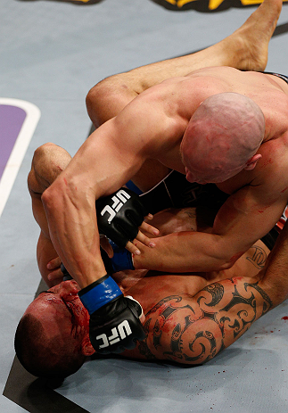 LONDON, ENGLAND - FEBRUARY 16: (R-L) Ryan Jimmo punches James Te Huna in their light heavyweight fight during the UFC on Fuel TV event on February 16, 2013 at Wembley Arena in London, England. (Photo by Josh Hedges/Zuffa LLC/Zuffa LLC via Getty Images)