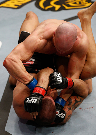 LONDON, ENGLAND - FEBRUARY 16: (R-L) Ryan Jimmo punches James Te Huna in their light heavyweight fight during the UFC on Fuel TV event on February 16, 2013 at Wembley Arena in London, England. (Photo by Josh Hedges/Zuffa LLC/Zuffa LLC via Getty Images)