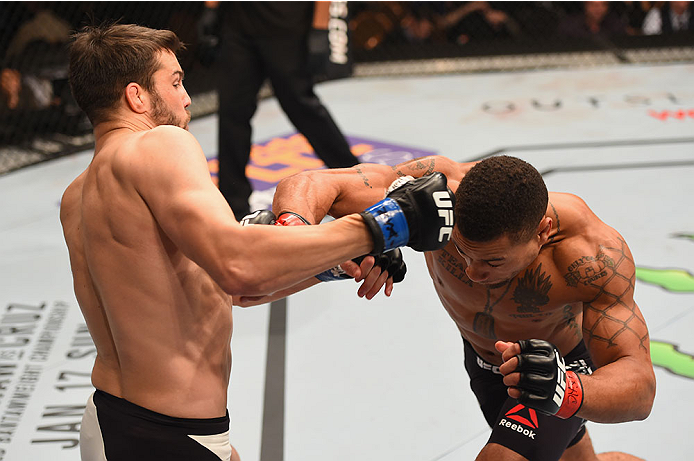 LAS VEGAS, NV - JANUARY 02: (R-L) Abel Trujillo punches Tony Sims in their lightweight bout during the UFC 195 event inside MGM Grand Garden Arena on January 2, 2016 in Las Vegas, Nevada. (Photo by Josh Hedges/Zuffa LLC/Zuffa LLC via Getty Images)