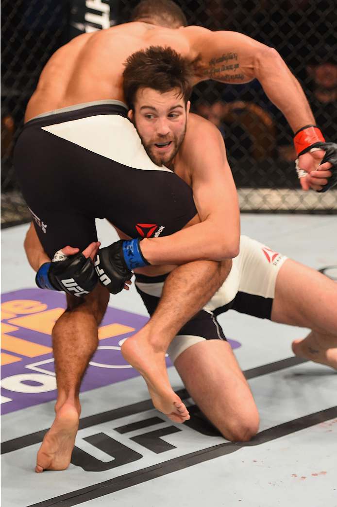 LAS VEGAS, NV - JANUARY 02: Tony Sims (white trunks) attempts to take down Abel Trujillo in their lightweight bout during the UFC 195 event inside MGM Grand Garden Arena on January 2, 2016 in Las Vegas, Nevada. (Photo by Josh Hedges/Zuffa LLC/Zuffa LLC