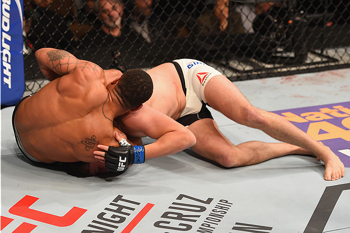 LAS VEGAS, NV - JANUARY 02: (L-R) Abel Trujillo attempts to submit Tony Sims in their lightweight bout during the UFC 195 event inside MGM Grand Garden Arena on January 2, 2016 in Las Vegas, Nevada. (Photo by Josh Hedges/Zuffa LLC/Zuffa LLC via Getty Im