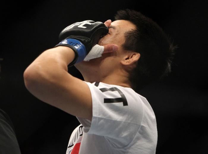TORONTO, ON - DECEMBER 10: "The Korean Zombie" Chan Sung Jung reacts after knocking out Mark Hominick during the UFC 140 event at Air Canada Centre on December 10, 2011 in Toronto, Ontario, Canada. (Photo by Josh Hedges/Zuffa LLC/Zuffa LLC via Getty Ima
