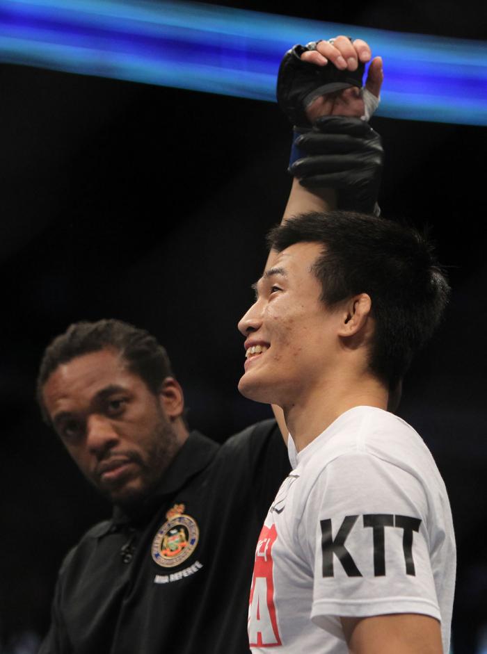 TORONTO, ON - DECEMBER 10: "The Korean Zombie" Chan Sung Jung reacts after knocking out Mark Hominick during the UFC 140 event at Air Canada Centre on December 10, 2011 in Toronto, Ontario, Canada. (Photo by Josh Hedges/Zuffa LLC/Zuffa LLC via Getty Ima