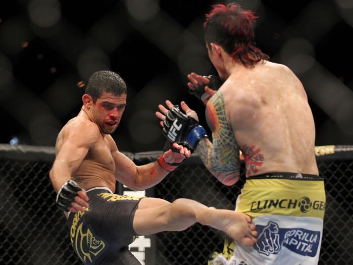 LAS VEGAS, NV - FEBRUARY 04: Renan Barao (left) kicks Scott Jorgensen during the UFC 143 event at Mandalay Bay Events Center on February 4, 2012 in Las Vegas, Nevada. (Photo by Josh Hedges/Zuffa LLC/Zuffa LLC via Getty Images) *** Local Caption *** Rena