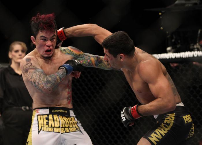 LAS VEGAS, NV - FEBRUARY 04: Renan Barao (right) punches Scott Jorgensen during the UFC 143 event at Mandalay Bay Events Center on February 4, 2012 in Las Vegas, Nevada. (Photo by Josh Hedges/Zuffa LLC/Zuffa LLC via Getty Images) *** Local Caption *** R