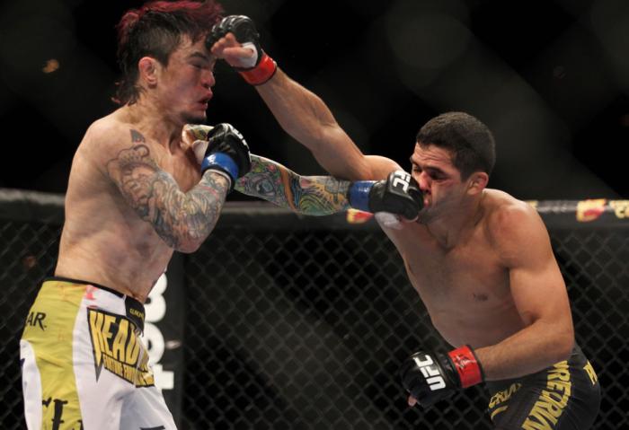 LAS VEGAS, NV - FEBRUARY 04: (L-R) Scott Jorgensen and Renan Barao exchange punches during the UFC 143 event at Mandalay Bay Events Center on February 4, 2012 in Las Vegas, Nevada. (Photo by Josh Hedges/Zuffa LLC/Zuffa LLC via Getty Images) *** Local Ca