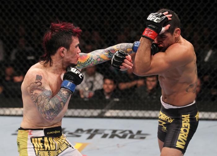 LAS VEGAS, NV - FEBRUARY 04: Scott Jorgensen (left) punches Renan Barao during the UFC 143 event at Mandalay Bay Events Center on February 4, 2012 in Las Vegas, Nevada. (Photo by Nick Laham/Zuffa LLC/Zuffa LLC via Getty Images) *** Local Caption *** Sco
