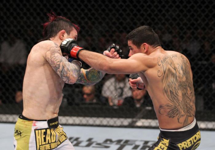 LAS VEGAS, NV - FEBRUARY 04: Renan Barao (right) punches Scott Jorgensen during the UFC 143 event at Mandalay Bay Events Center on February 4, 2012 in Las Vegas, Nevada. (Photo by Nick Laham/Zuffa LLC/Zuffa LLC via Getty Images) *** Local Caption *** Re