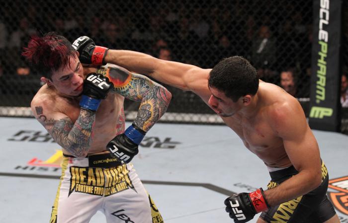 LAS VEGAS, NV - FEBRUARY 04: Renan Barao (right) punches Scott Jorgensen during the UFC 143 event at Mandalay Bay Events Center on February 4, 2012 in Las Vegas, Nevada. (Photo by Nick Laham/Zuffa LLC/Zuffa LLC via Getty Images) *** Local Caption *** Re