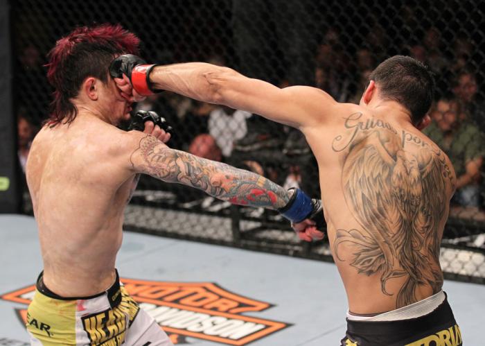 LAS VEGAS, NV - FEBRUARY 04: Renan Barao (right) punches Scott Jorgensen during the UFC 143 event at Mandalay Bay Events Center on February 4, 2012 in Las Vegas, Nevada. (Photo by Nick Laham/Zuffa LLC/Zuffa LLC via Getty Images) *** Local Caption *** Re