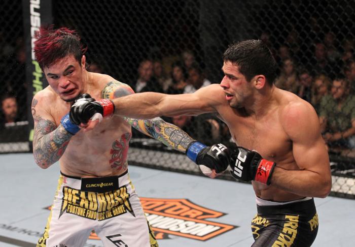 LAS VEGAS, NV - FEBRUARY 04: Scott Jorgensen (left) and Renan Barao (right) exchange punches during the UFC 143 event at Mandalay Bay Events Center on February 4, 2012 in Las Vegas, Nevada. (Photo by Nick Laham/Zuffa LLC/Zuffa LLC via Getty Images) ***